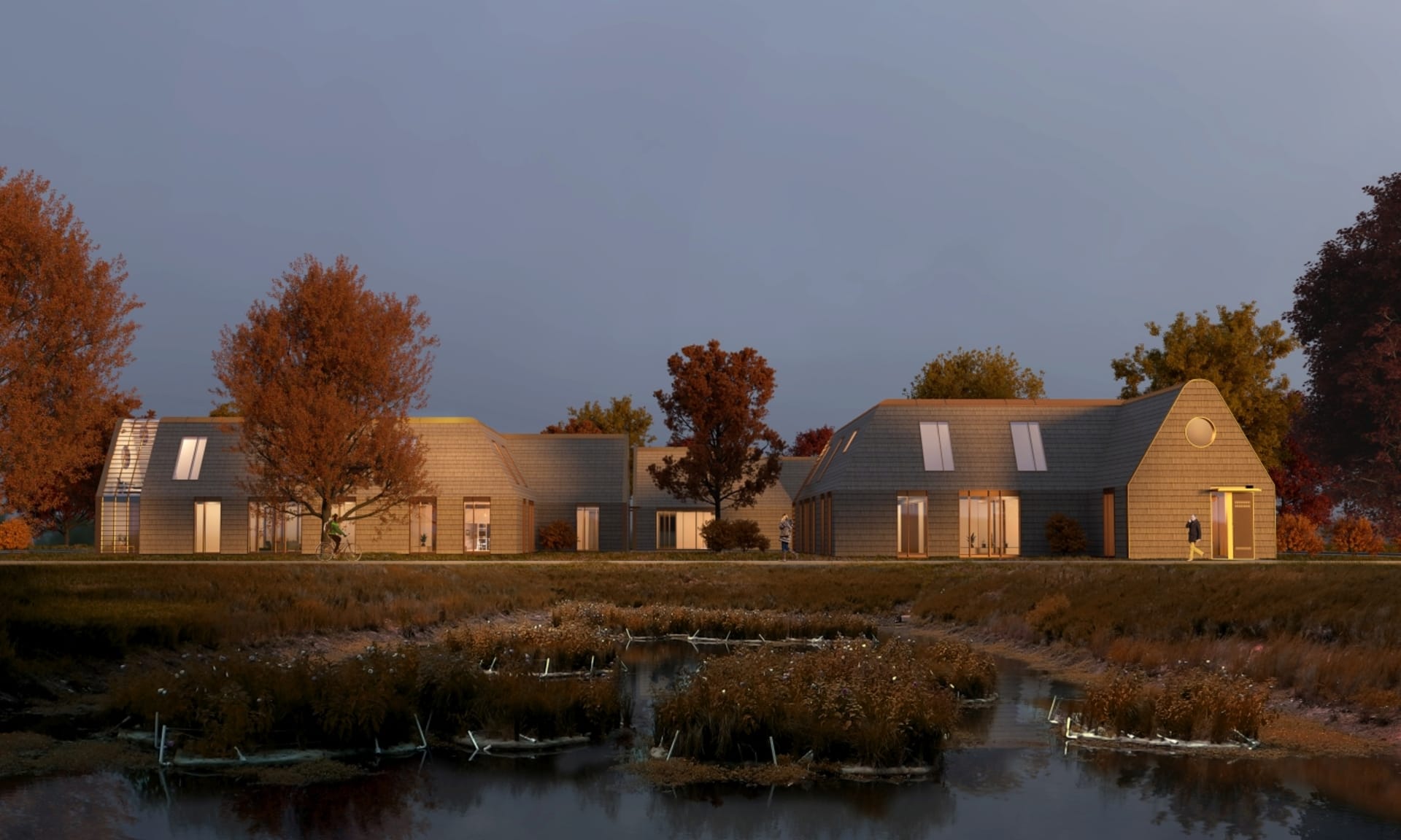 Wooden communal housing next to a lake